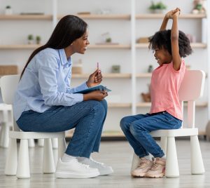 ACLH behavior analyst with child success